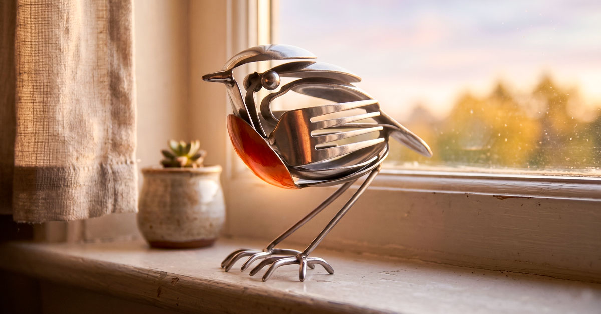 Handcrafted Metal Feathers Glow With Quiet Resilience